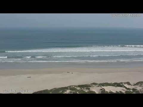 Strand Beach live webcam showing beautiful sandy shore and ocean waves in Western Cape South Africa