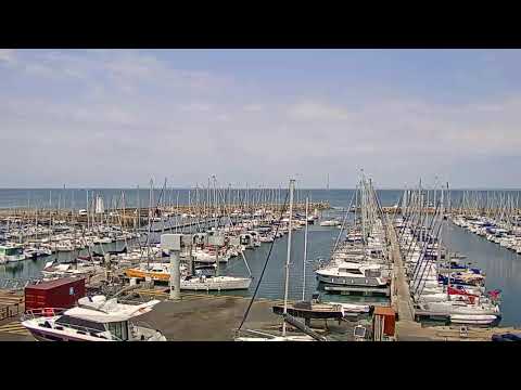 Live view of Piriac sur Mer Marina with boats and coastal scenery in Pays De La Loire France