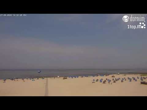 Scenic view of Dornumersiel harbor and coastline in Germany captured by live webcam