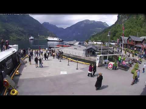 Live view of Geirangerfjord cruise port with fjords and cruise ships in Geiranger, Norway