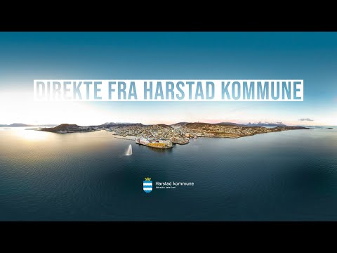 Live view of Harstad harbor with boats and mountains in Norway