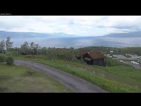 Live panoramic view of Bjorkliden Lapland Resorts with snowy mountains and pine forests in Sweden